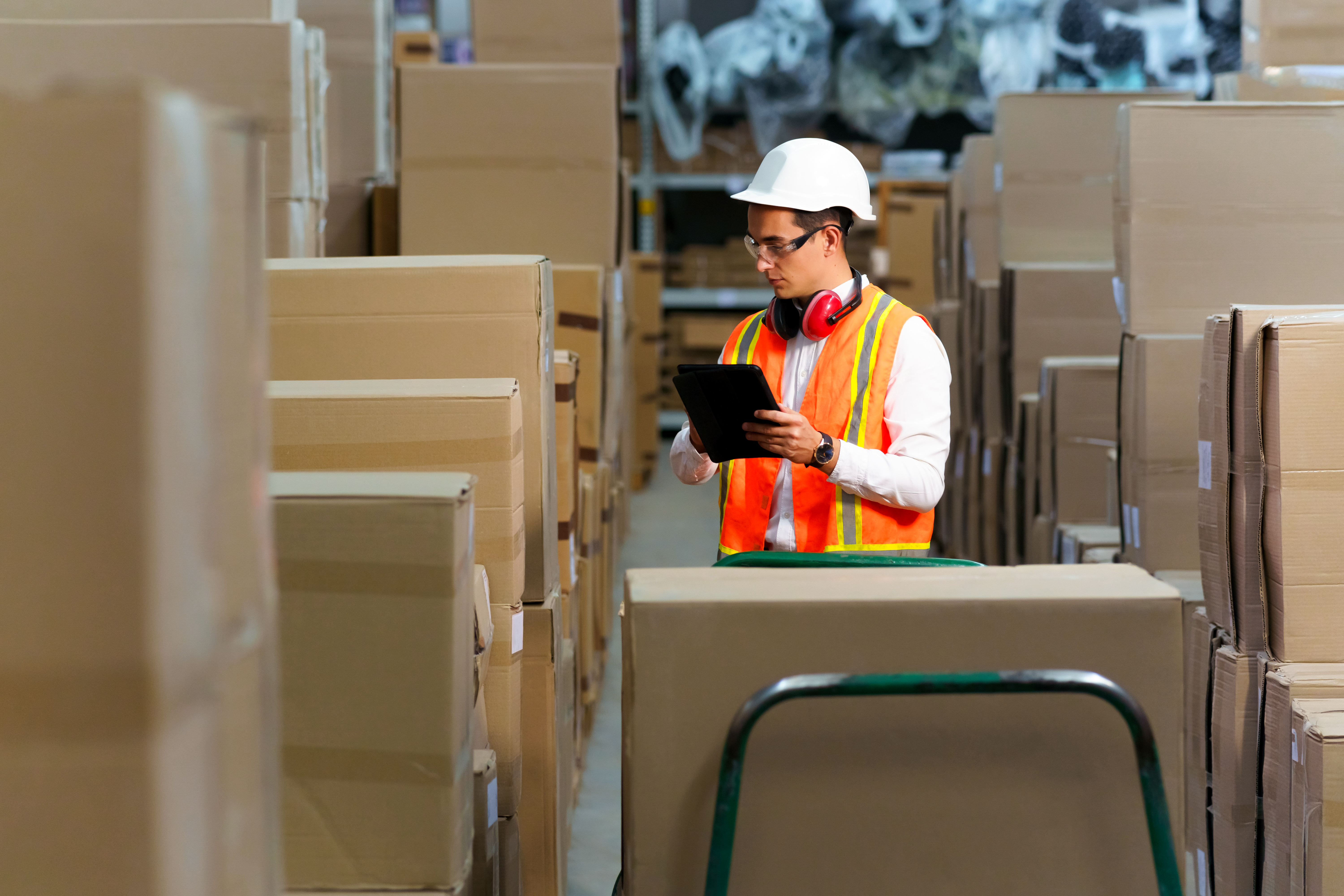 Employee of a logistics warehouse conducts an inventory of products